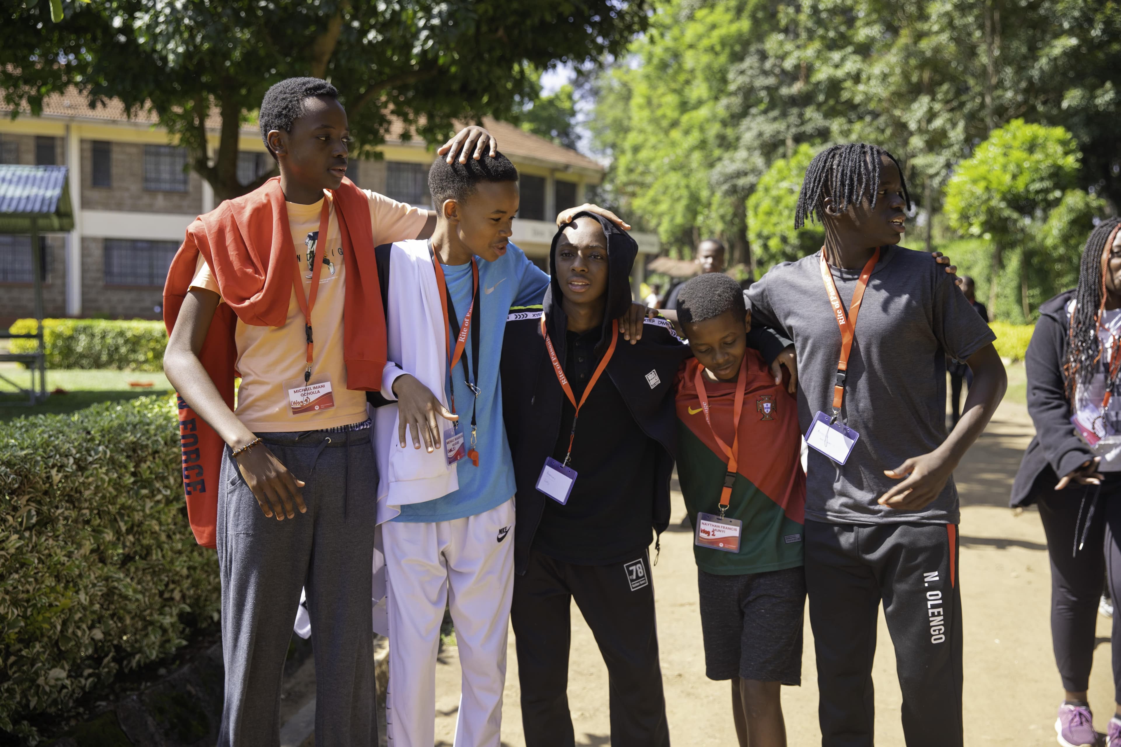 A group of smiling students in a classroom setting.